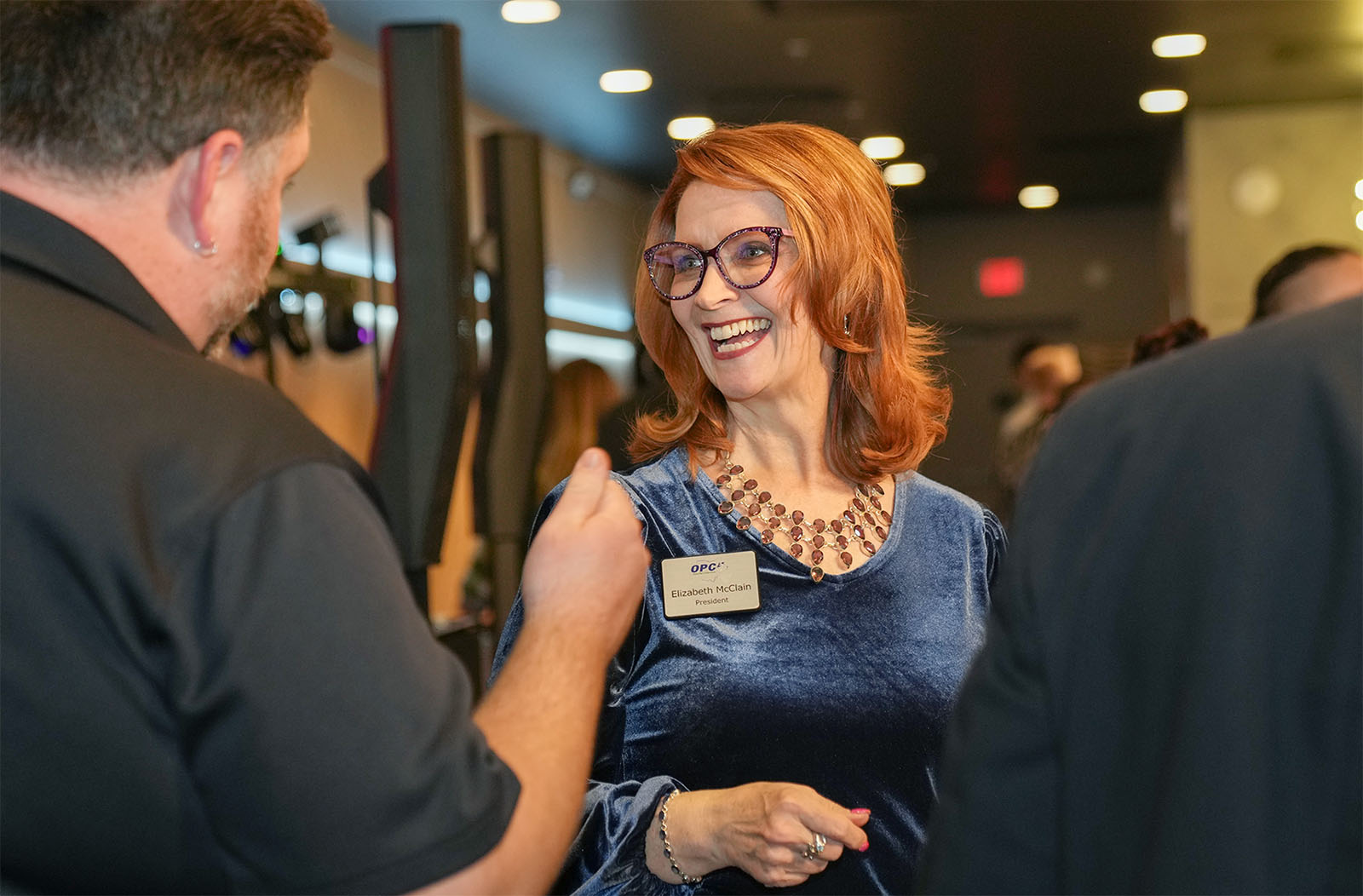 Elizabeth McClain speaking with OPC event attendee